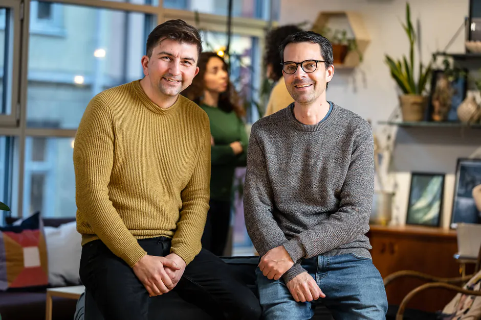 Two people smiling at the camera