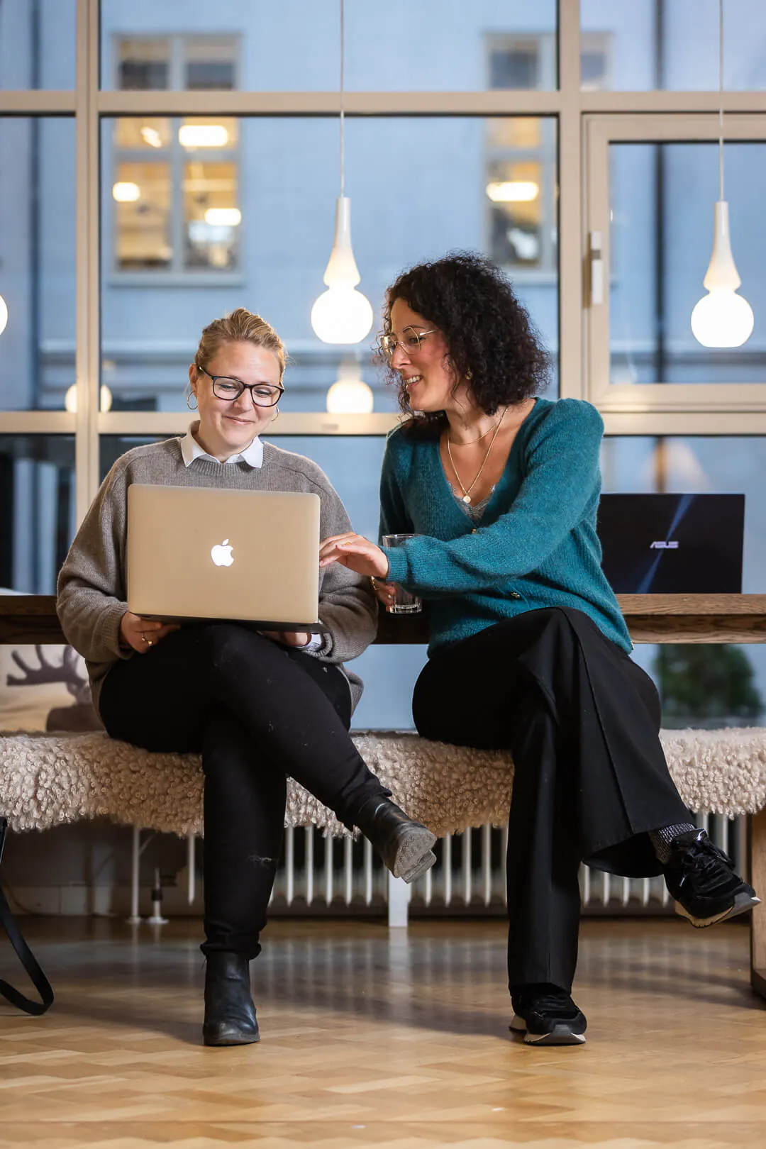 Two participants looking at a computer together